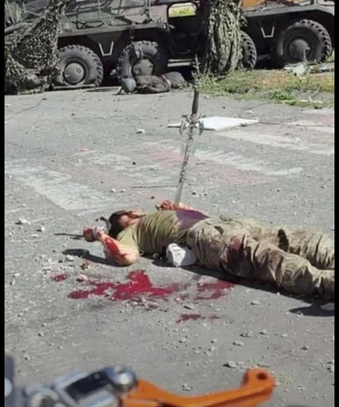 *GRAPHIC* Another war crime as Ukrainian soldier is slaughtered with a sword that says "For Kursk"-0