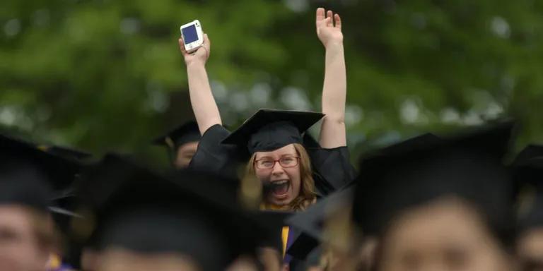  academic gown academic robe judge's robe mortarboard hand-held computer hand-held microcomputer cellular telephone cellular phone cellphone cell mobile phone-0