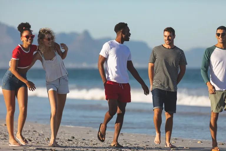  sandbar sand bar seashore coast seacoast sea-coast swimming trunks bathing trunks sunglasses dark glasses shades-0