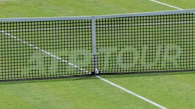  racket racquet tennis ball chainlink fence window screen-0