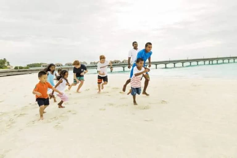  sandbar sand bar swimming trunks bathing trunks seashore coast seacoast sea-coast soccer ball-0